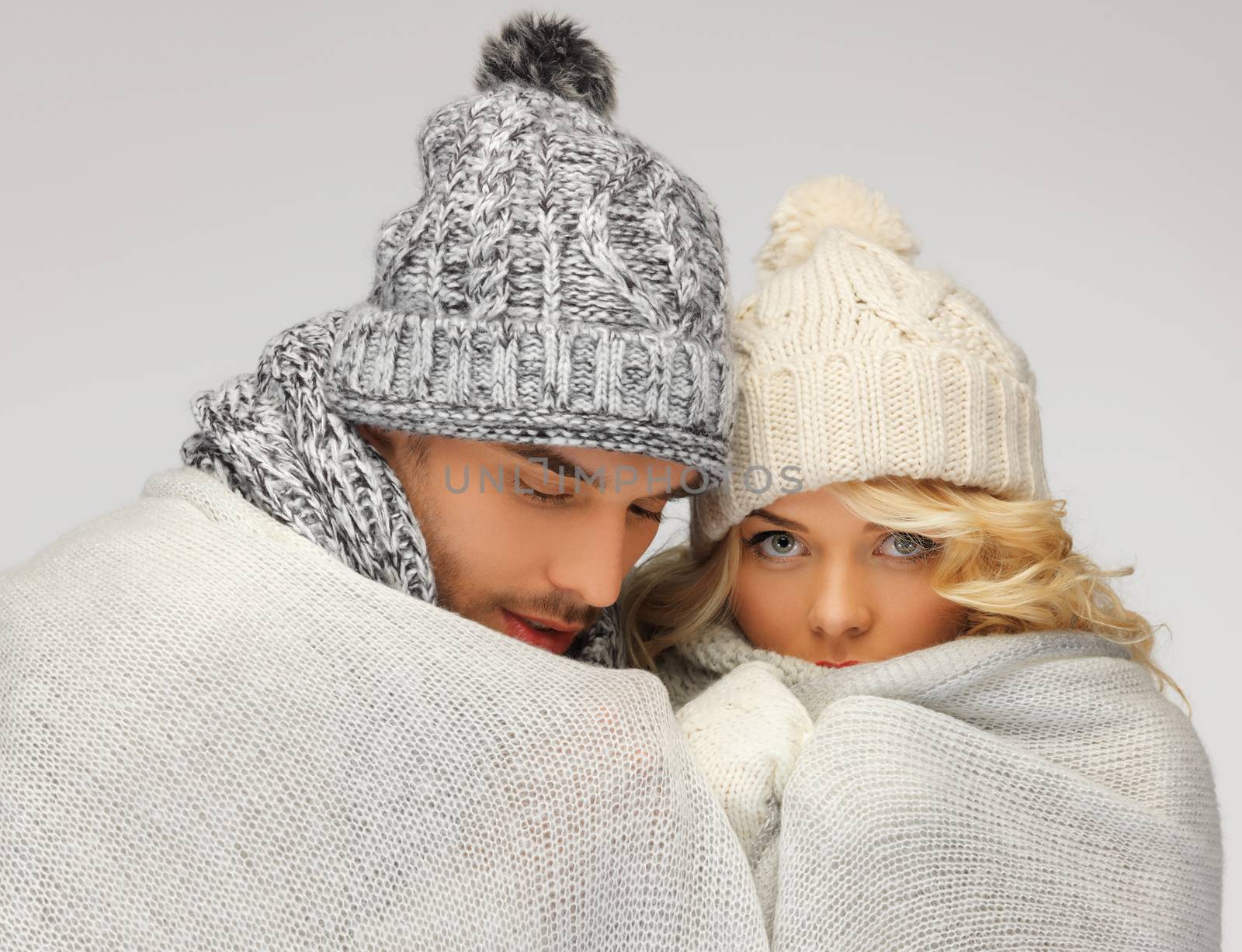 bright picture of family couple under warm blanket