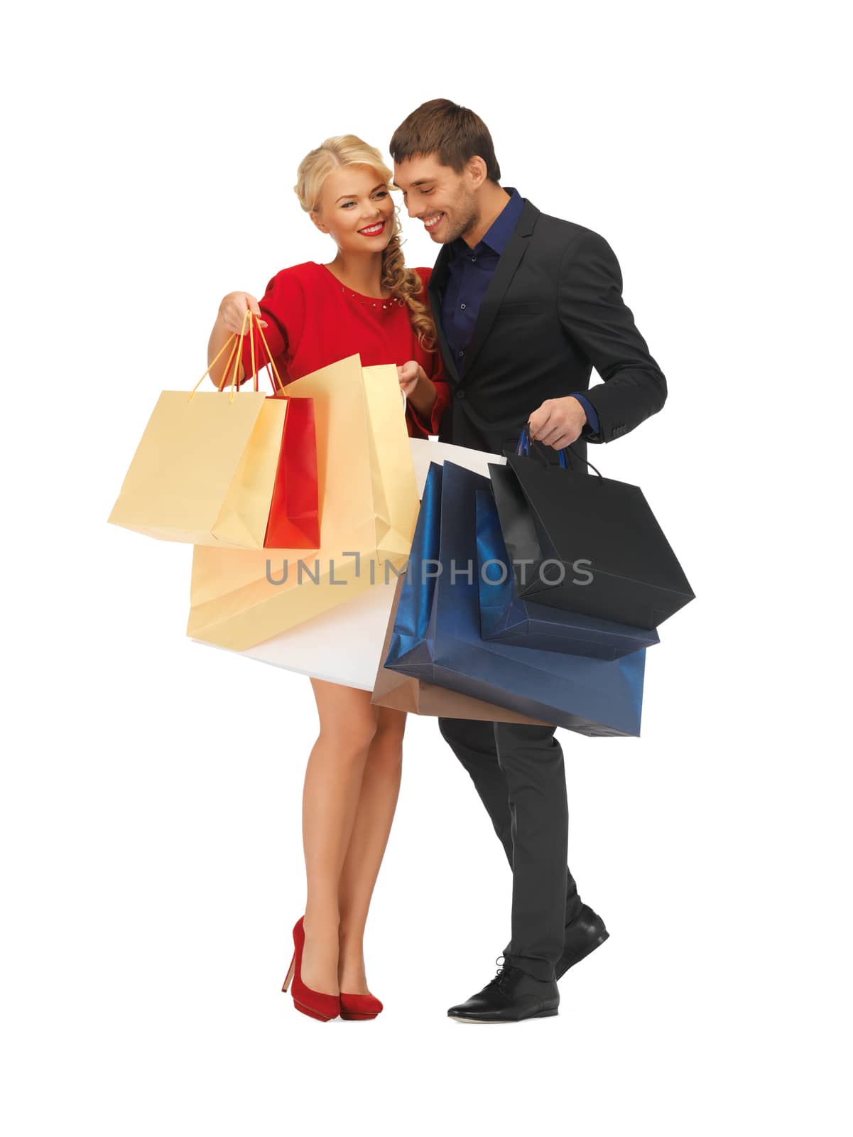 man and woman with shopping bags by dolgachov