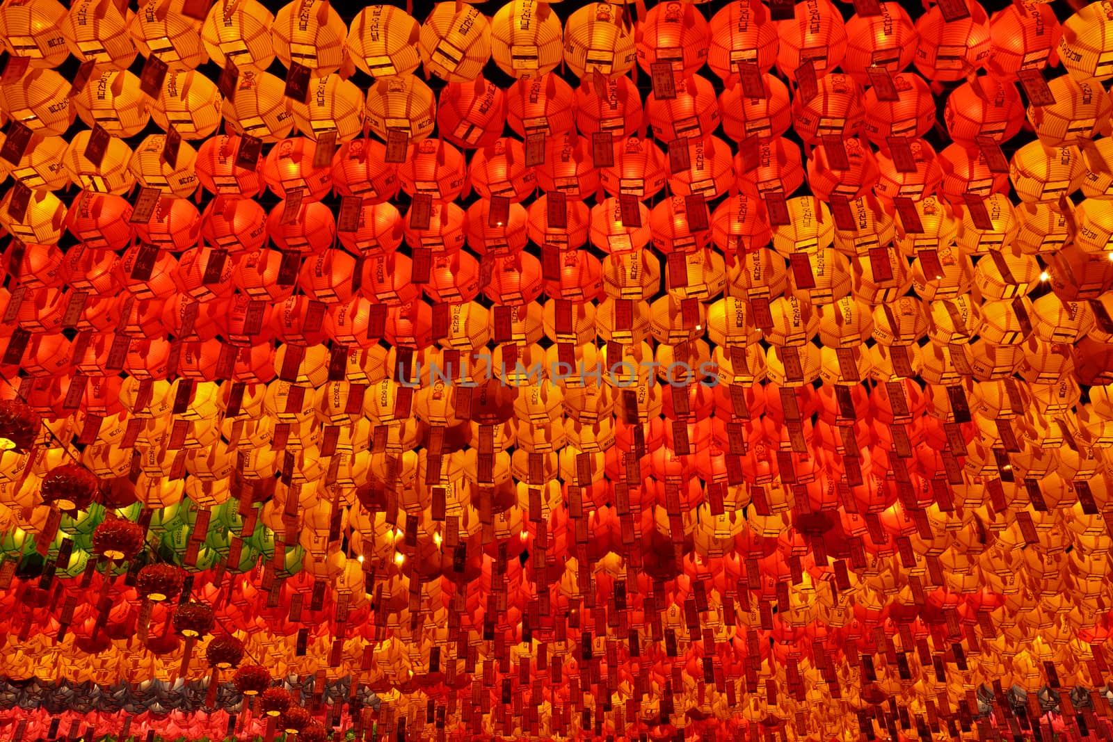 Many red, yellow and green glowing lanterns on Buddha's birthday, perspective view