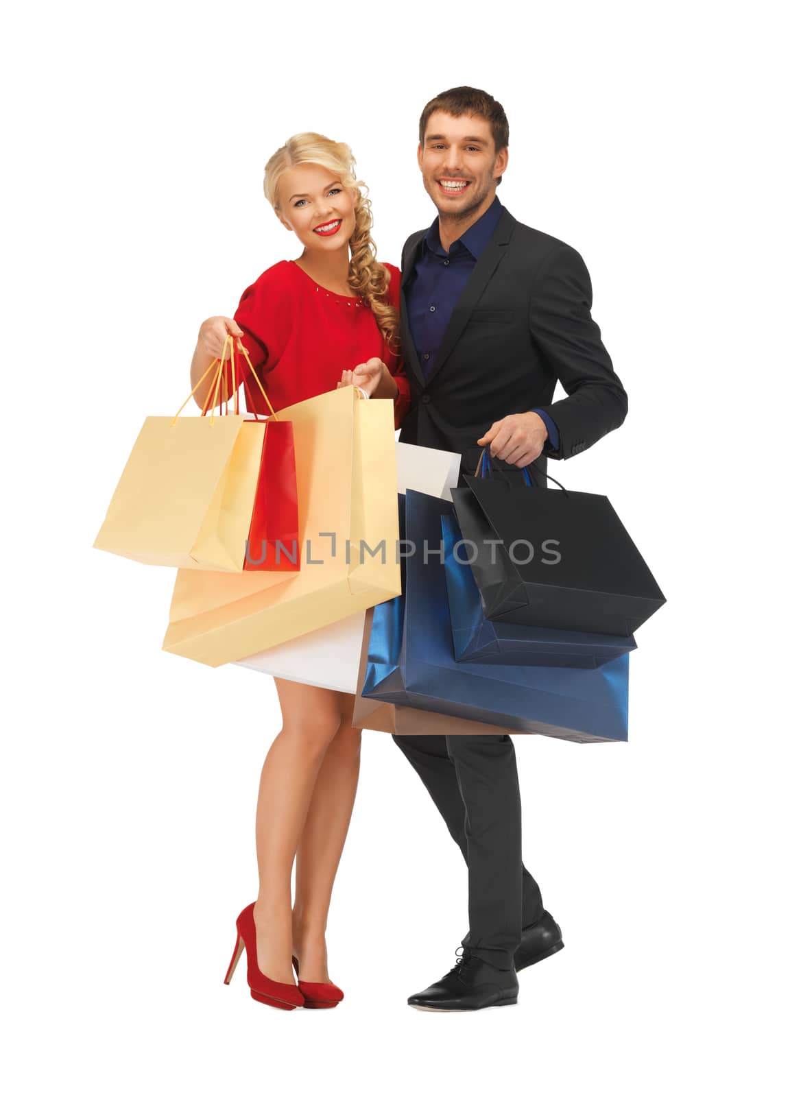 man and woman with shopping bags by dolgachov