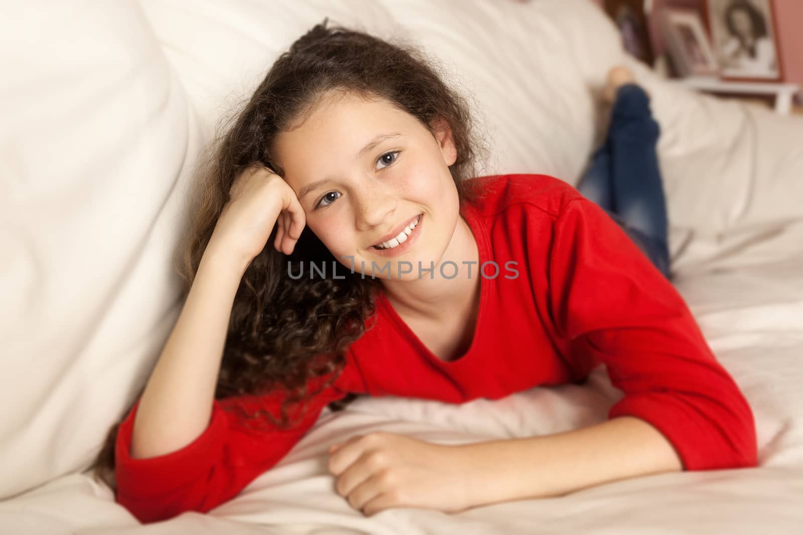 An image of a girl relaxing at the sofa