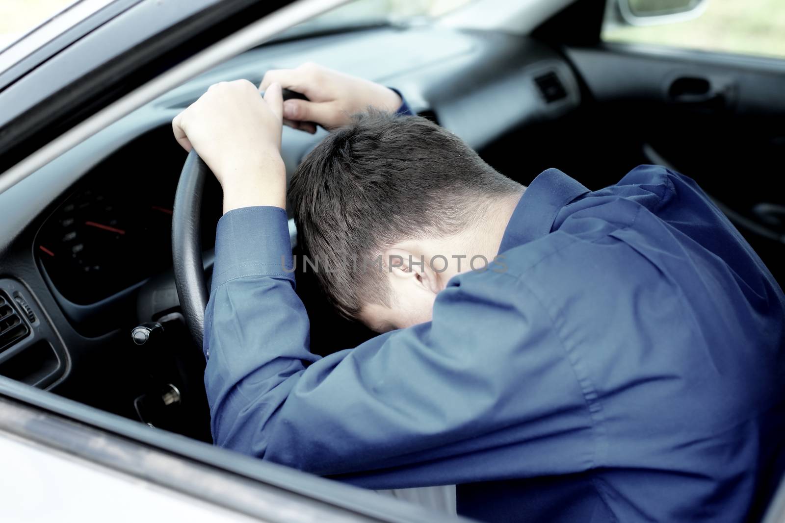 Young Man fall asleep in a Car