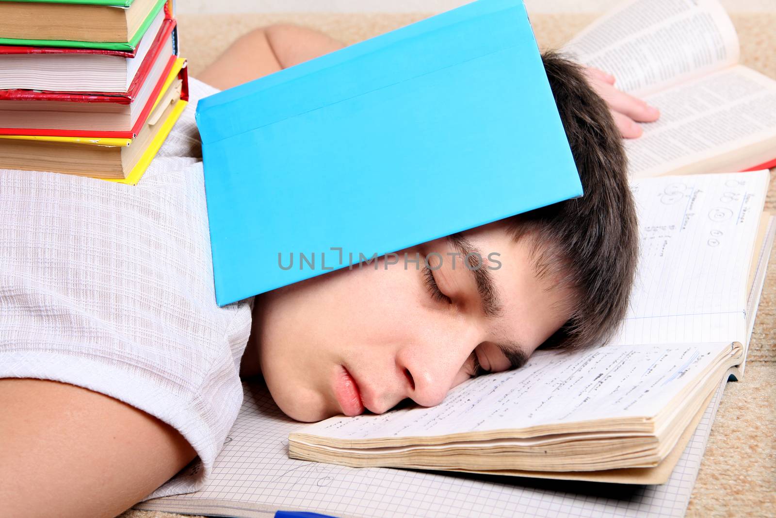 Teenager sleeps on the Books by sabphoto