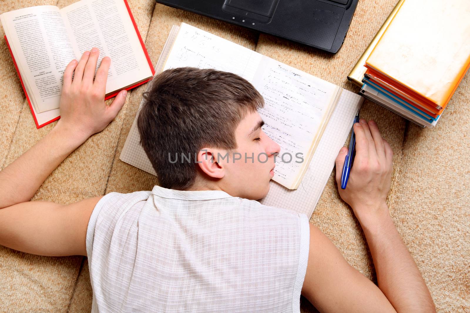 Teenager sleeps on the Books by sabphoto