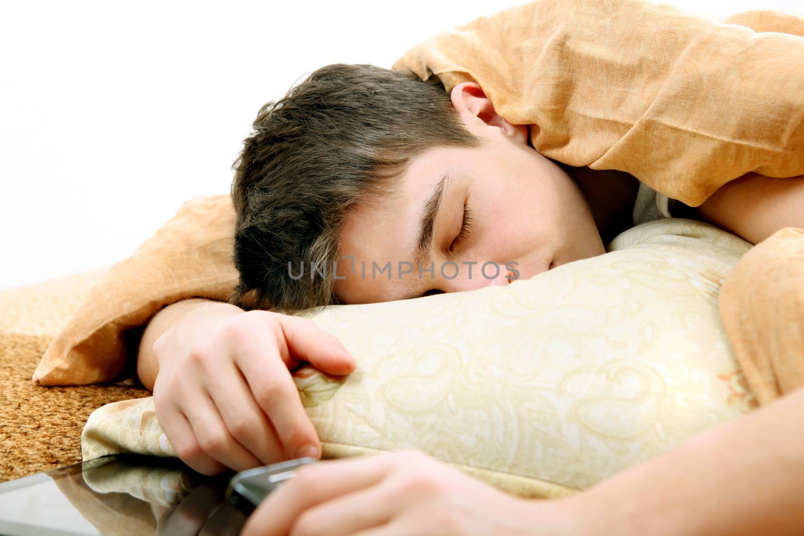 Tired Teenager sleeping on the Bed at the Home