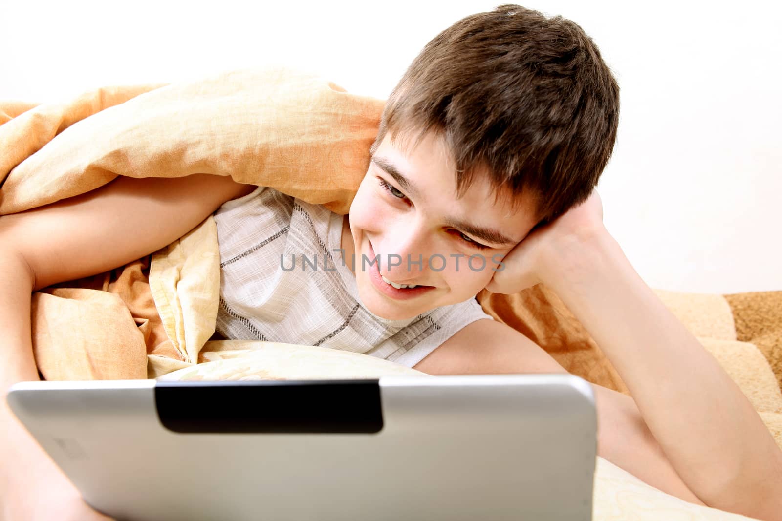 Teenager with Tablet Computer by sabphoto