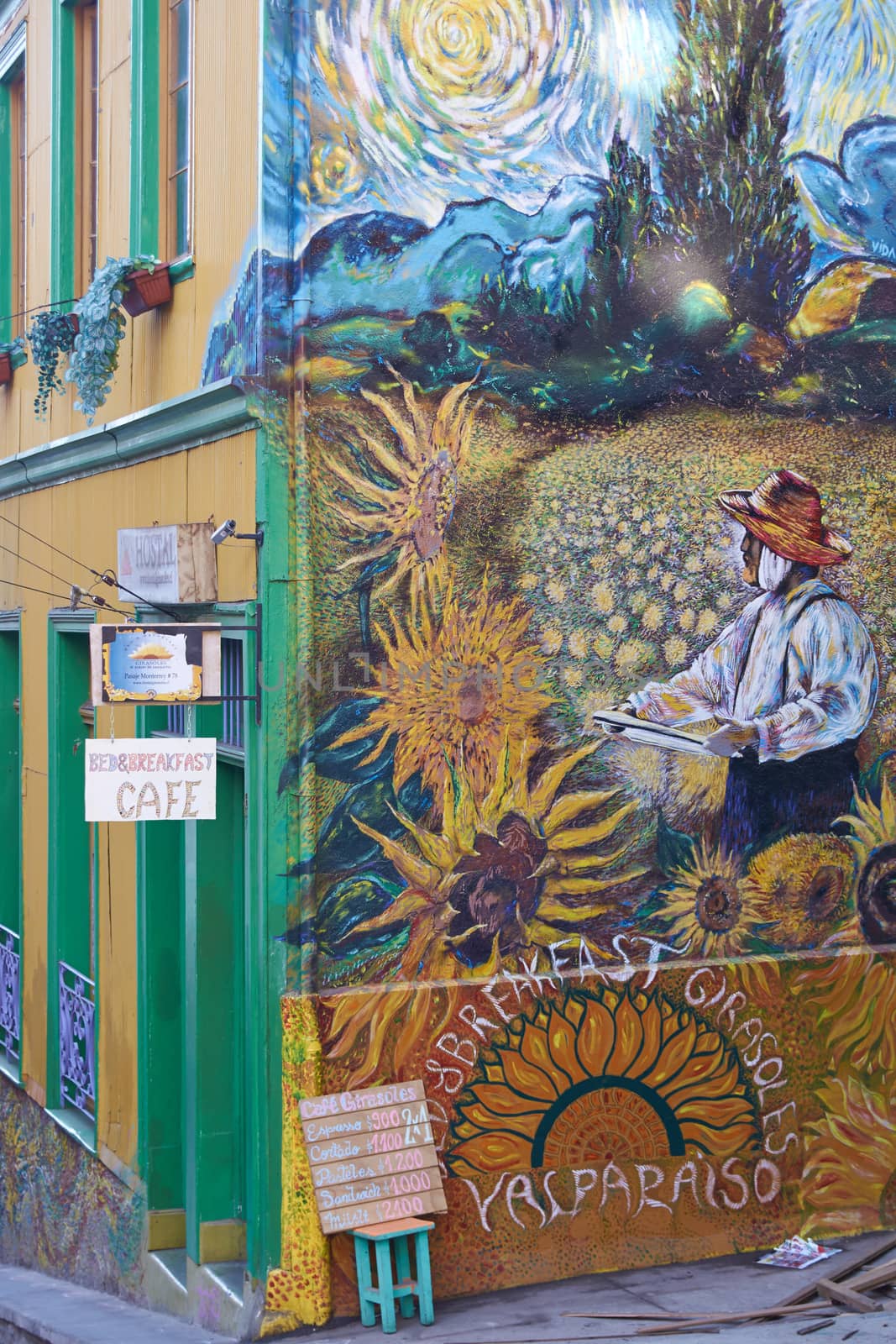 Colourful graffiti in an Impressionist style decorating a cafe in the world heritage city of Valparaiso in Chile