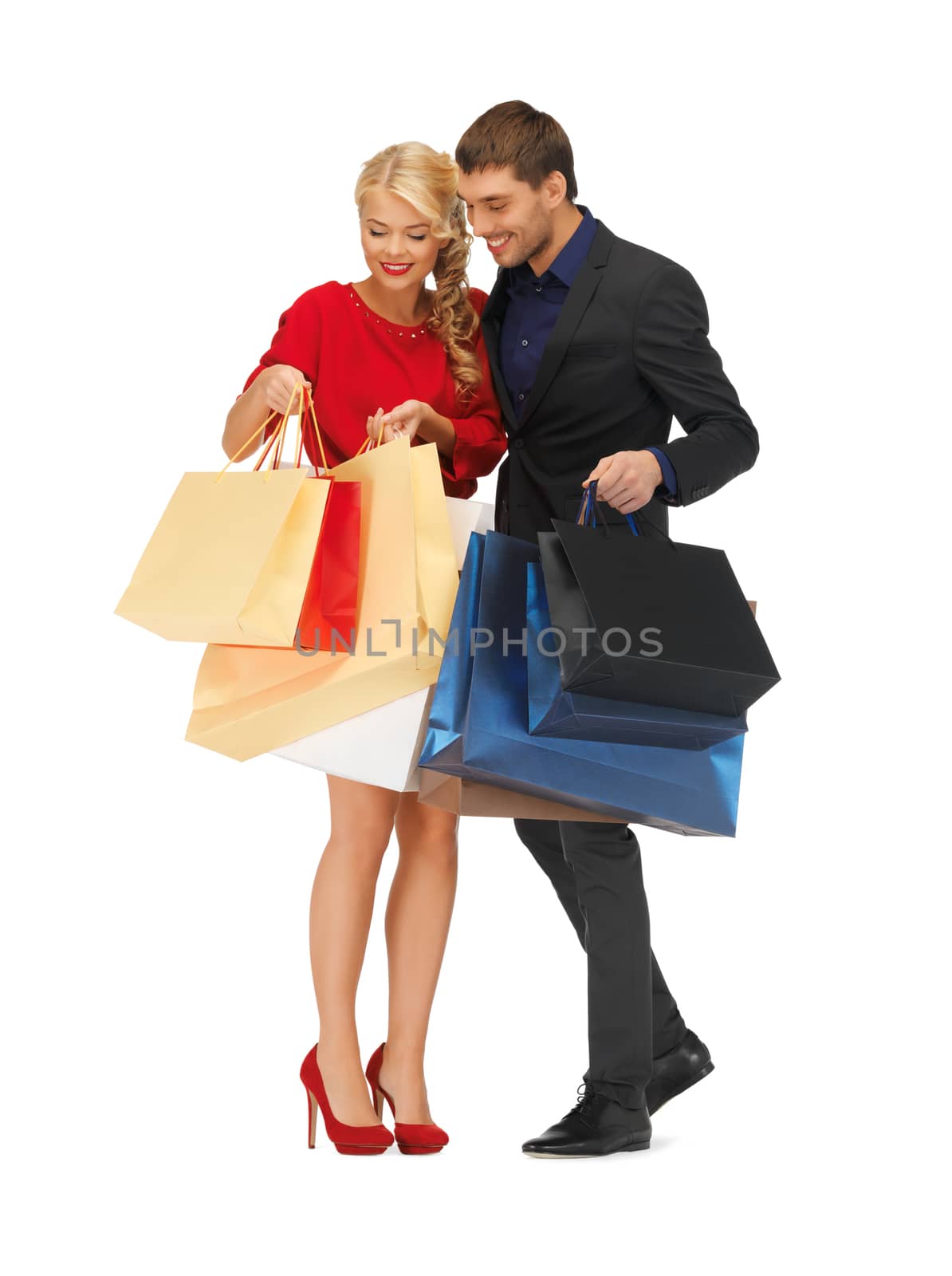 man and woman with shopping bags by dolgachov