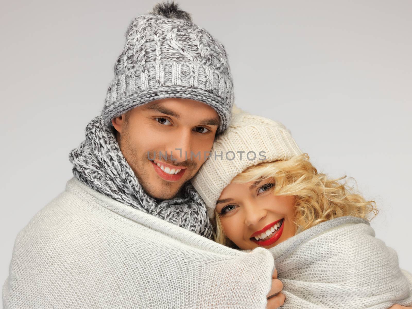 bright picture of family couple under warm blanket