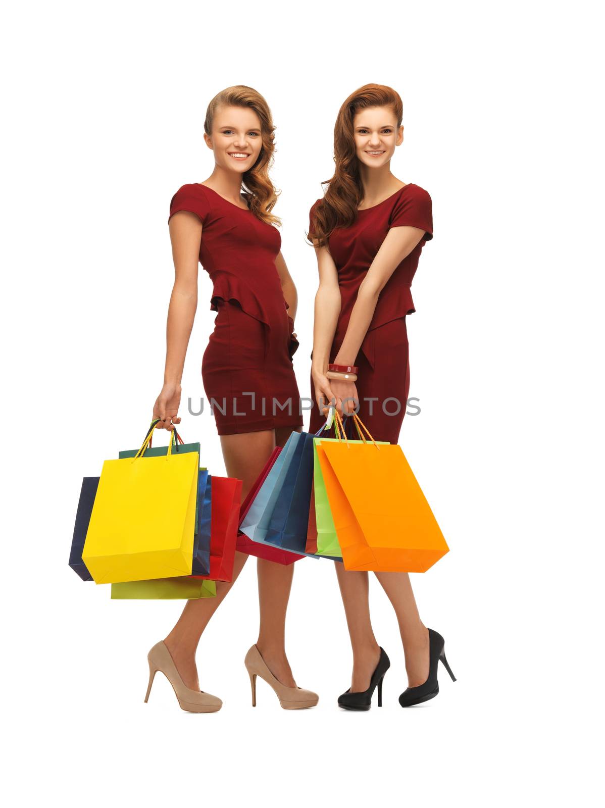 picture of two teenage girls in red dresses with shopping bags