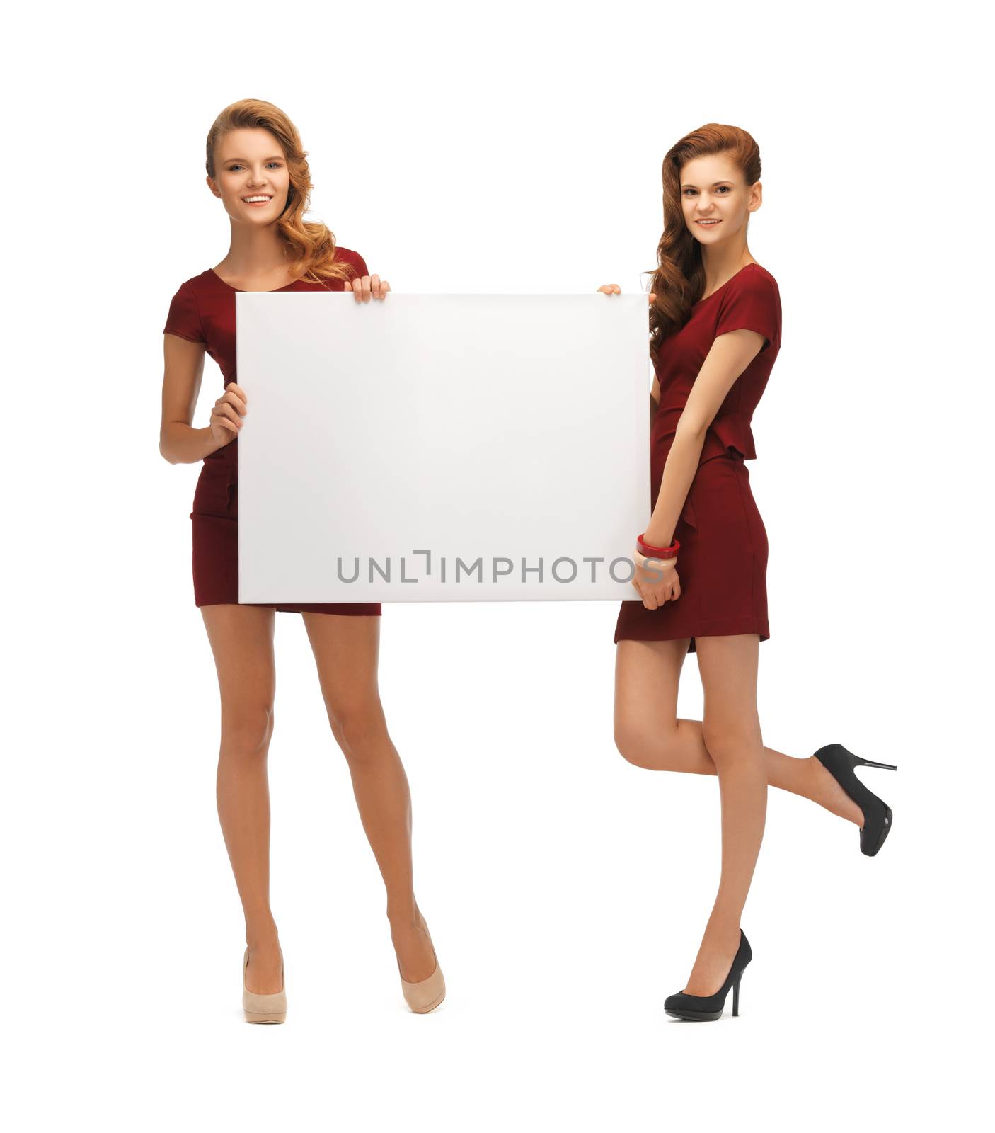 two teenage girls in red dresses with blank board by dolgachov