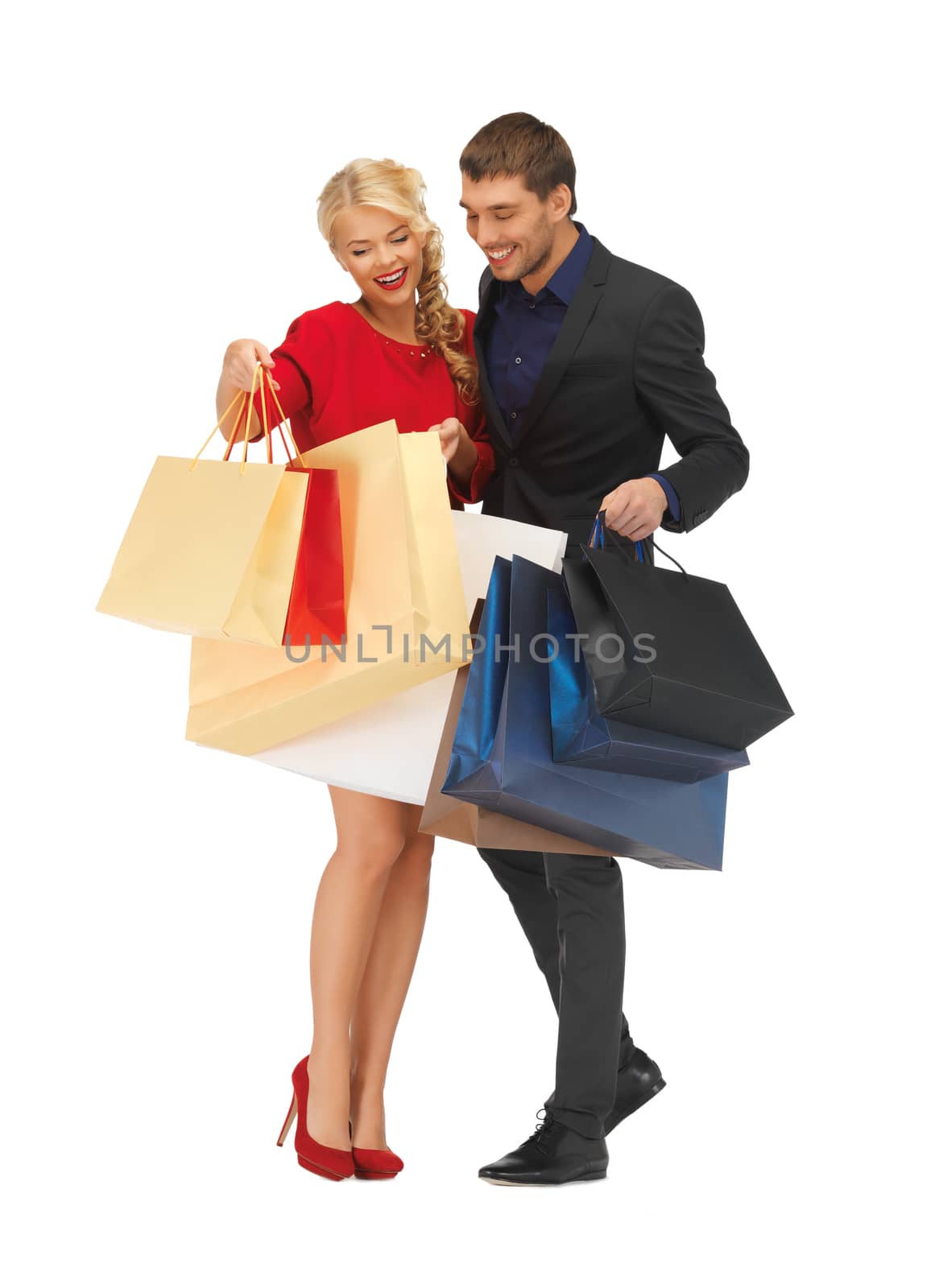 man and woman with shopping bags by dolgachov