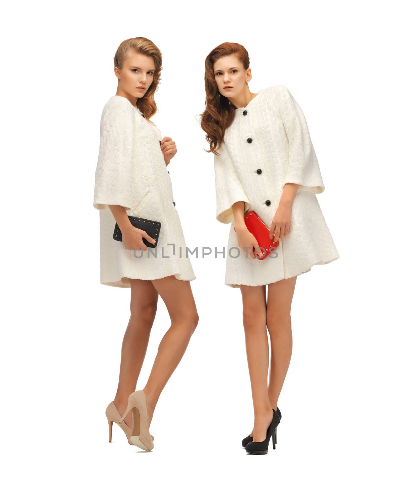 two teenage girls in white coats with clutches by dolgachov