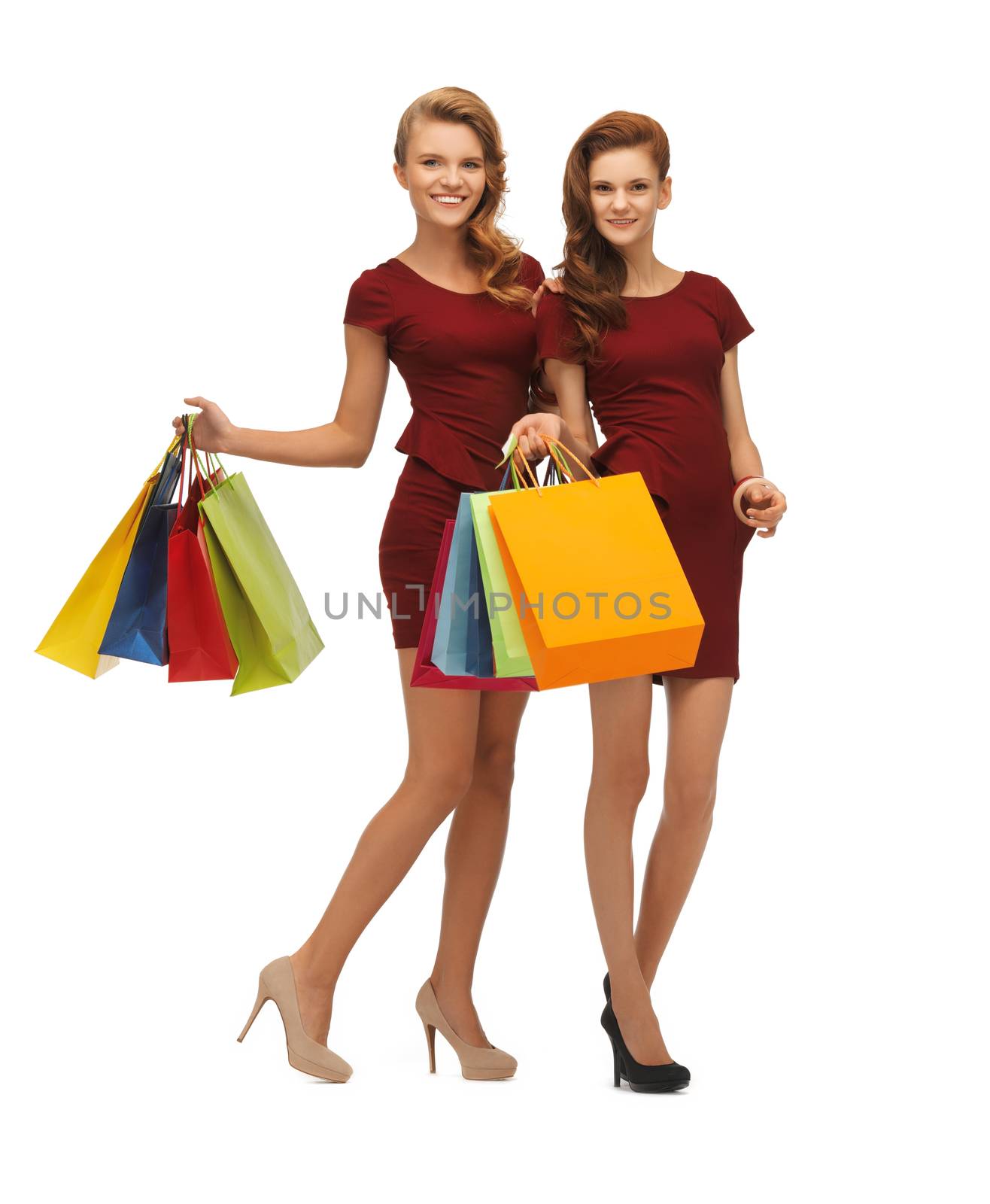 picture of two teenage girls in red dresses with shopping bags