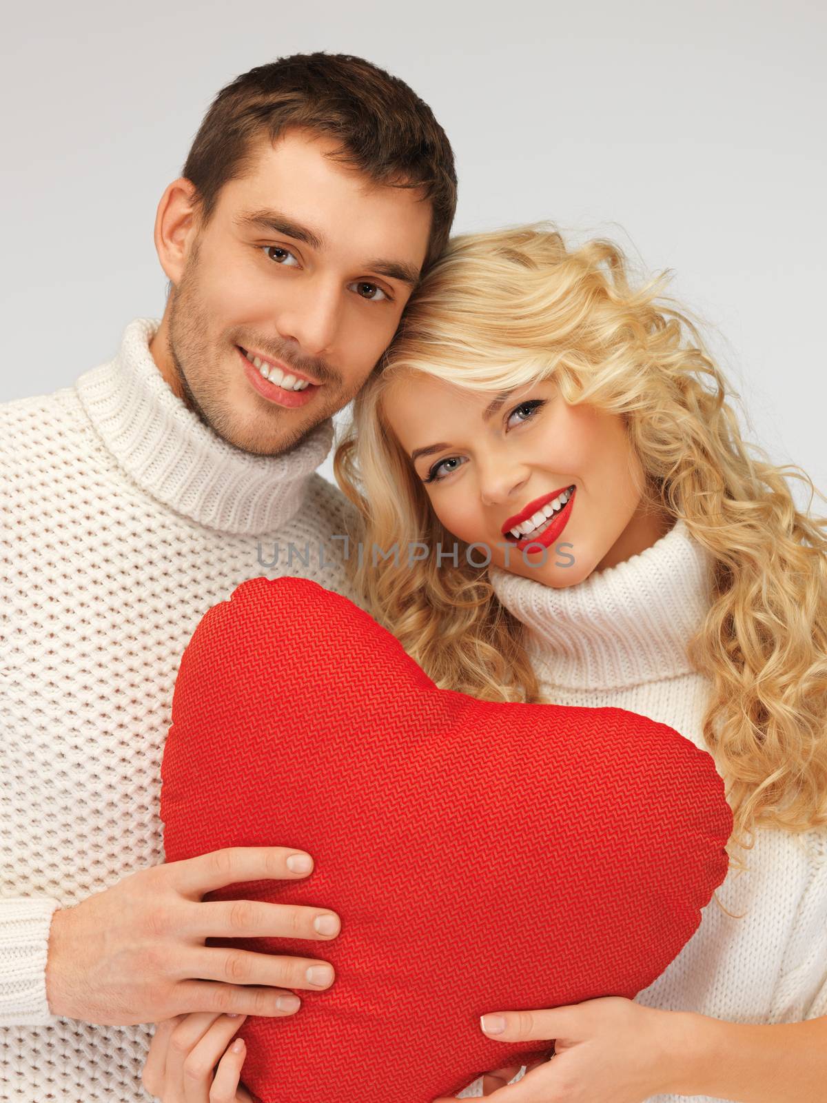 family couple in a sweaters with heart by dolgachov