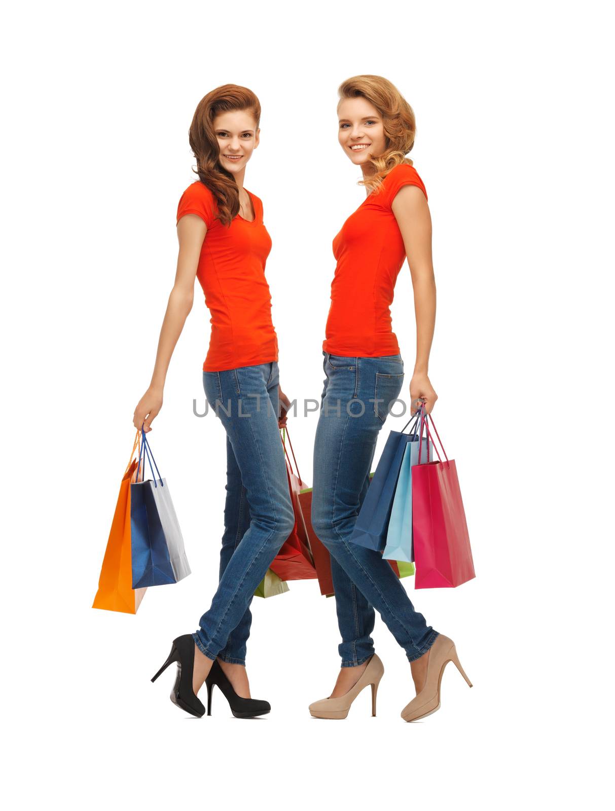 two teenage girls with shopping bags by dolgachov