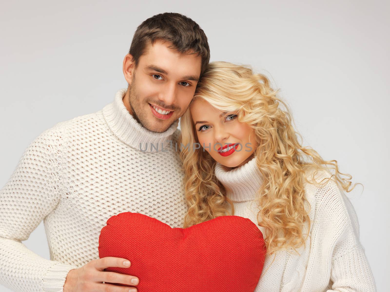 family couple in a sweaters with heart by dolgachov