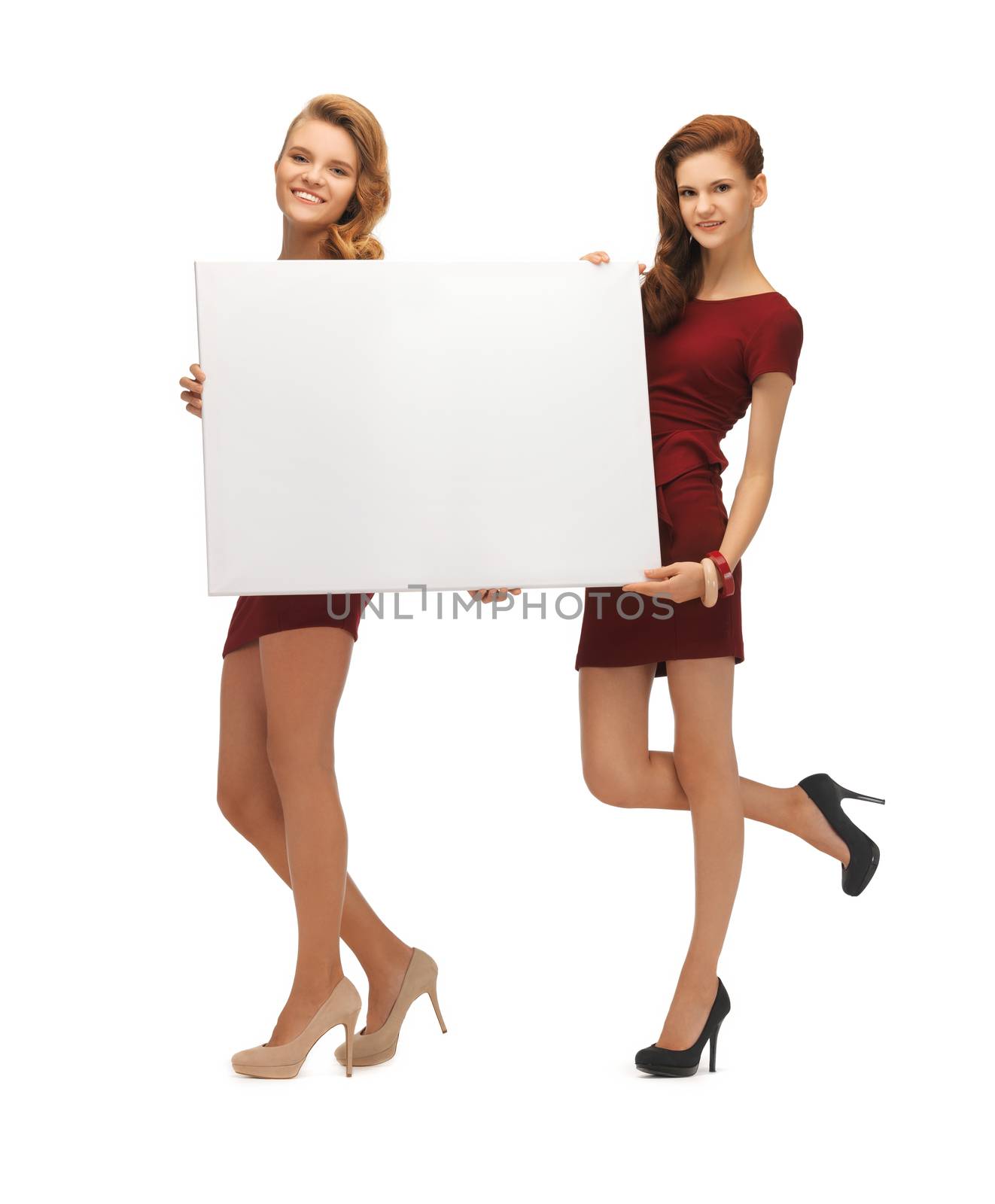 two teenage girls in red dresses with blank board by dolgachov