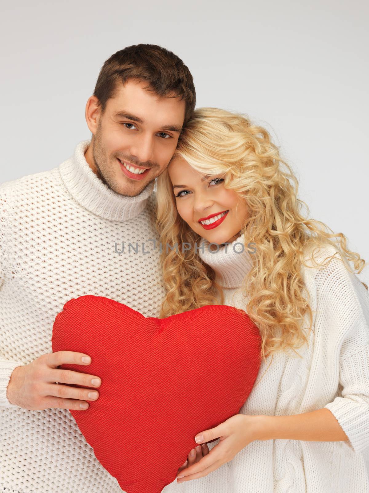 picture of family couple in a sweaters with heart