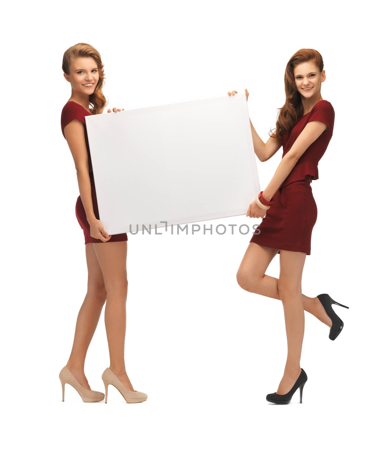 two teenage girls in red dresses with blank board by dolgachov