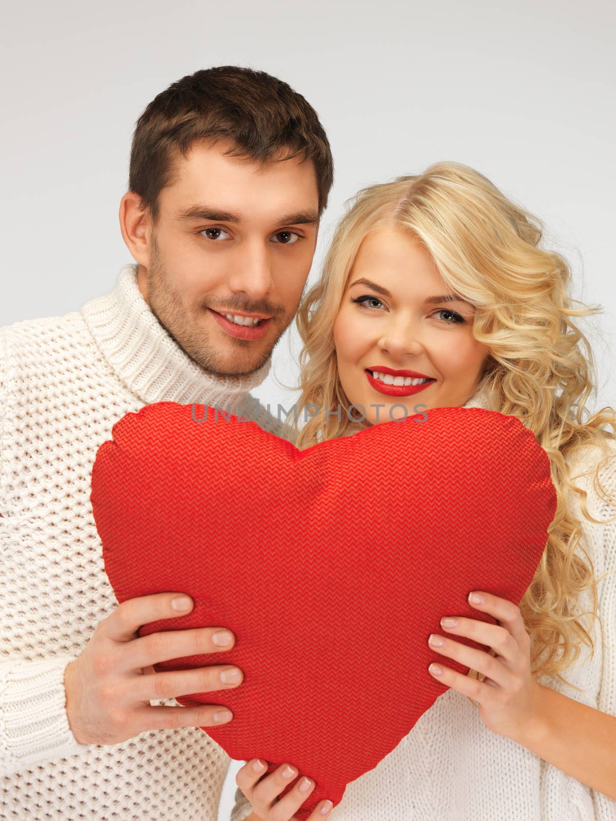 picture of family couple in a sweaters with heart