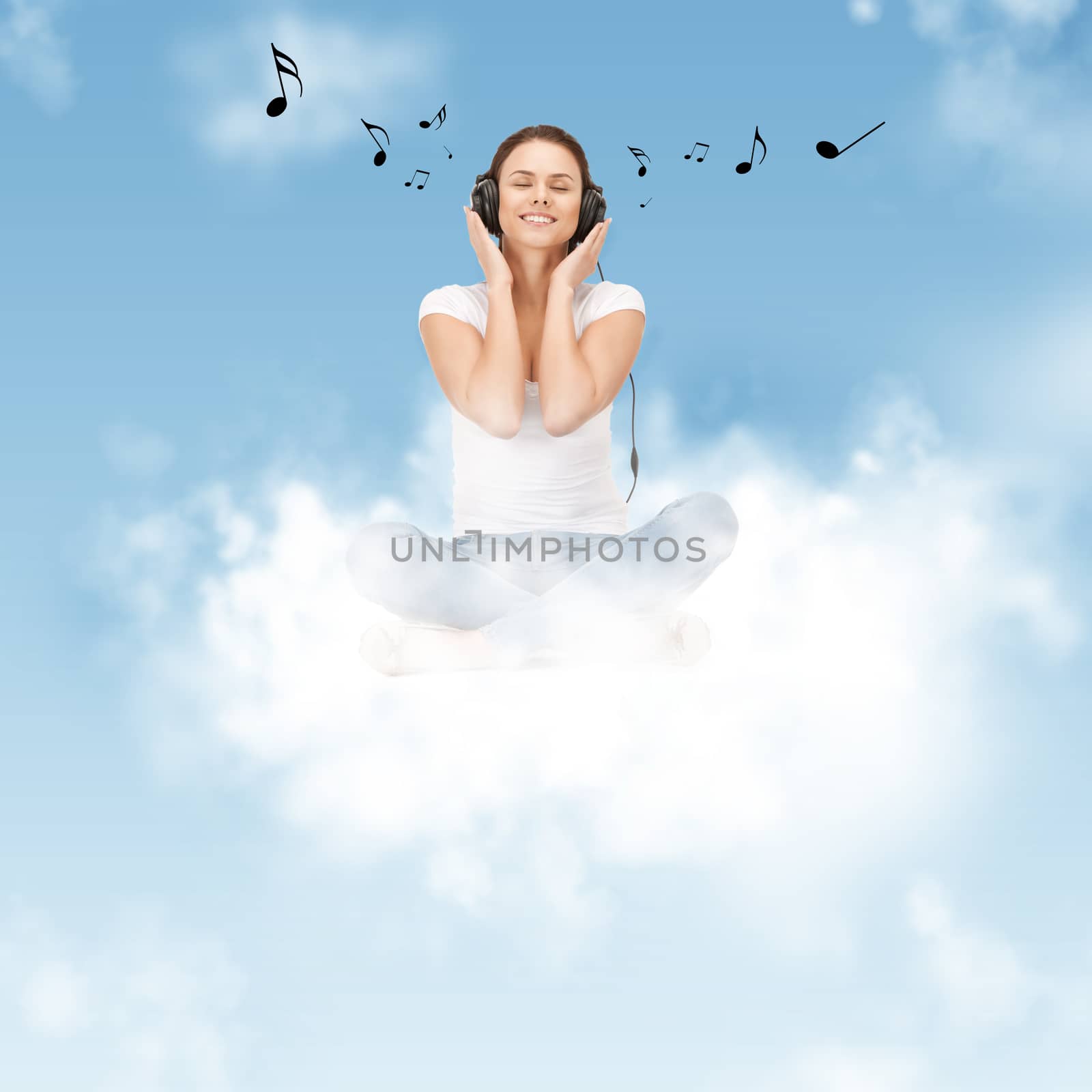 picture of happy teenage girl in big headphones sitting on cloud