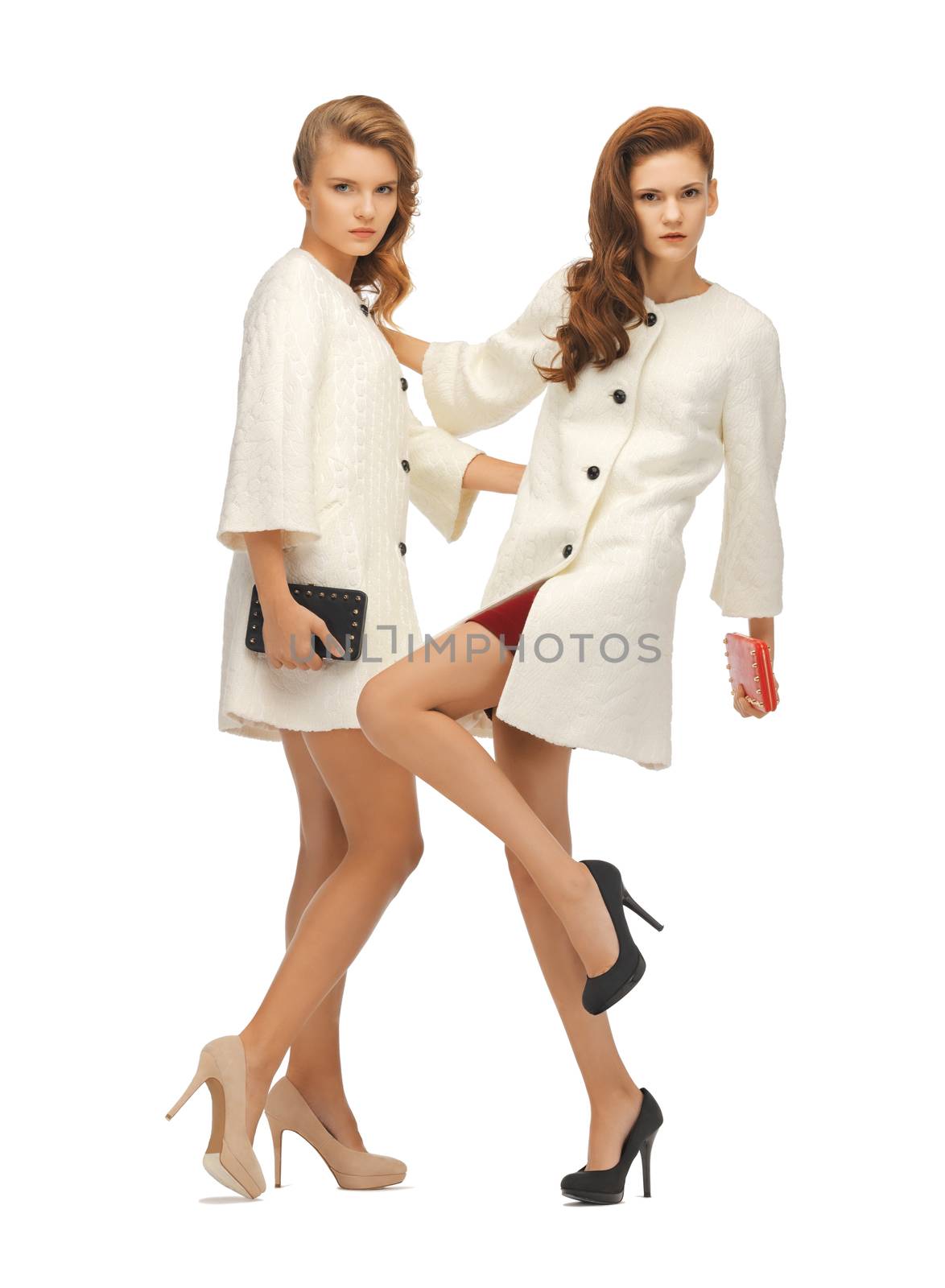 two teenage girls in white coats with clutches by dolgachov