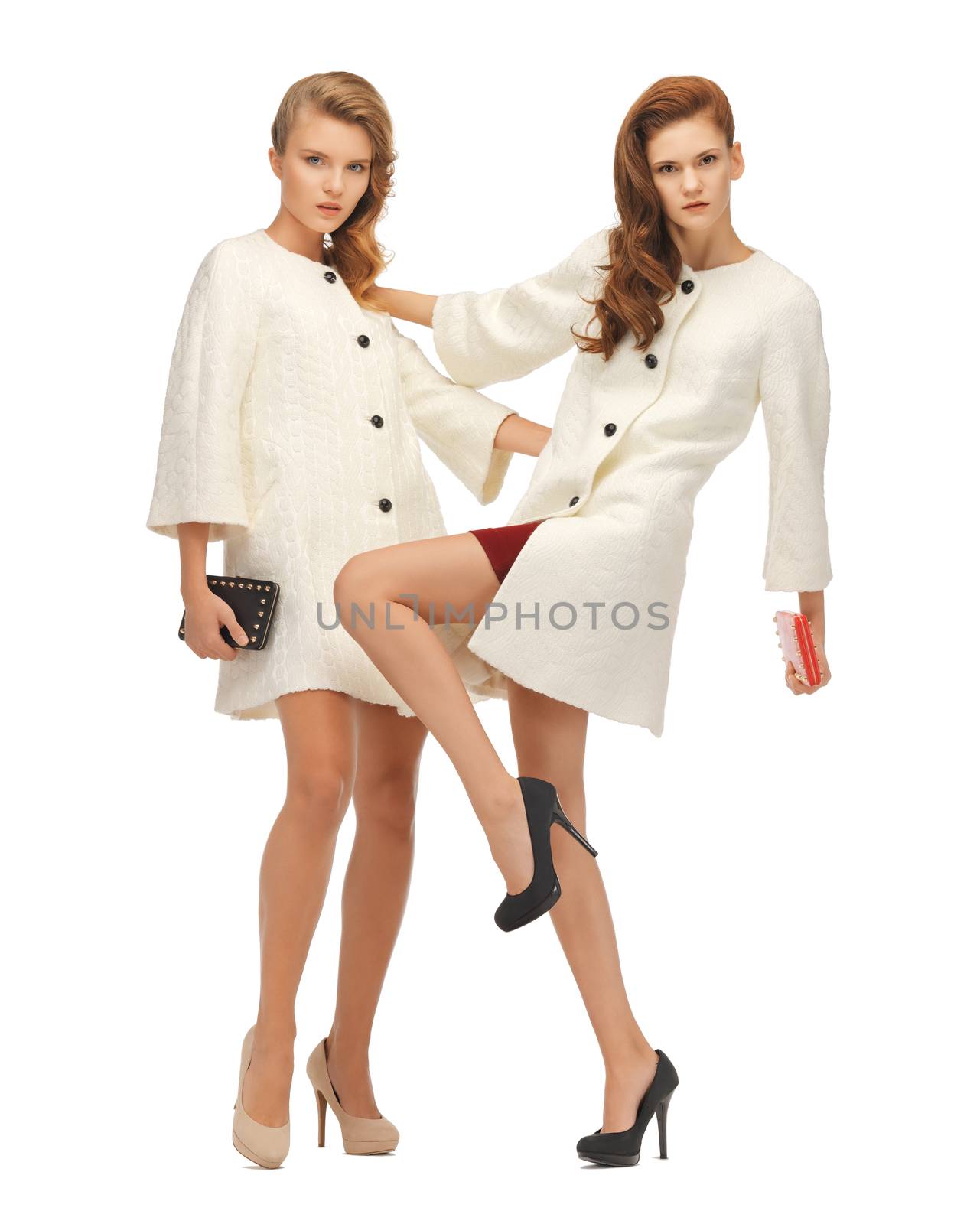 two teenage girls in white coats with clutches by dolgachov