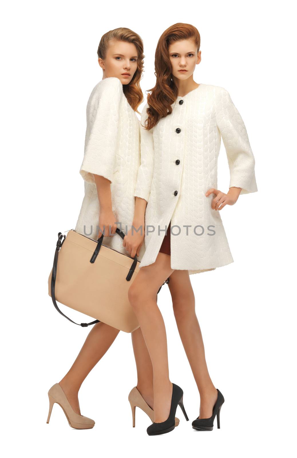 two teenage girls in white coats with bag by dolgachov