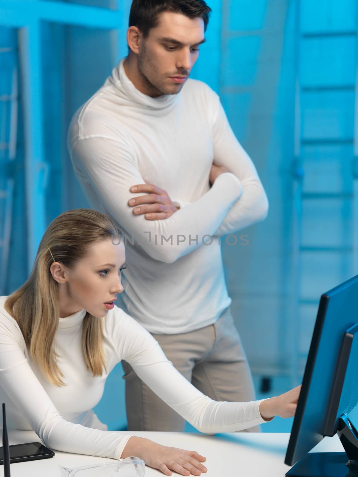 picture of man and woman in space laboratory