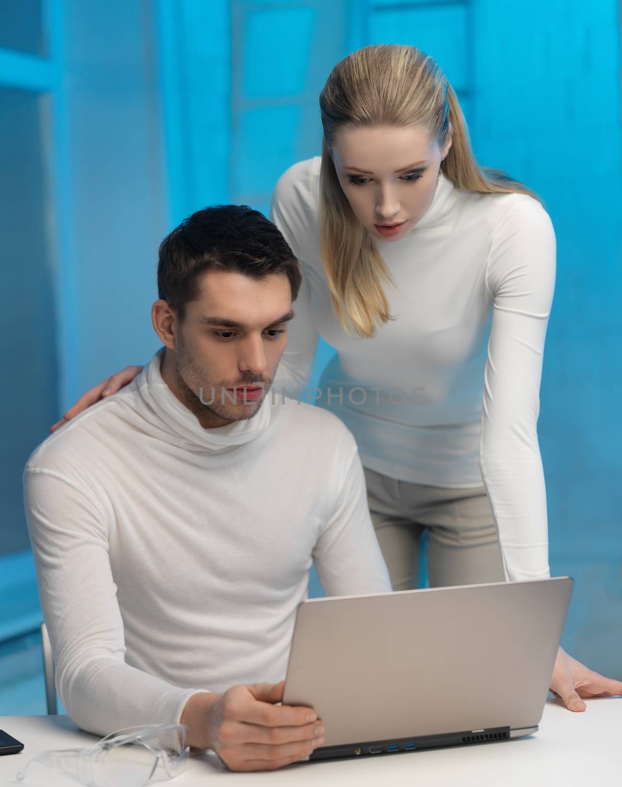 picture of man and woman in space laboratory