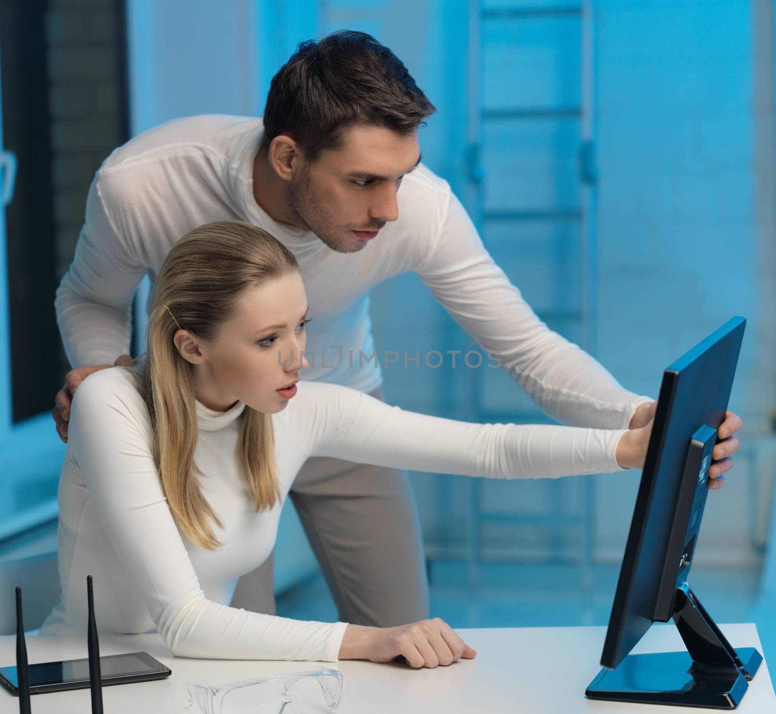 picture of man and woman in space laboratory