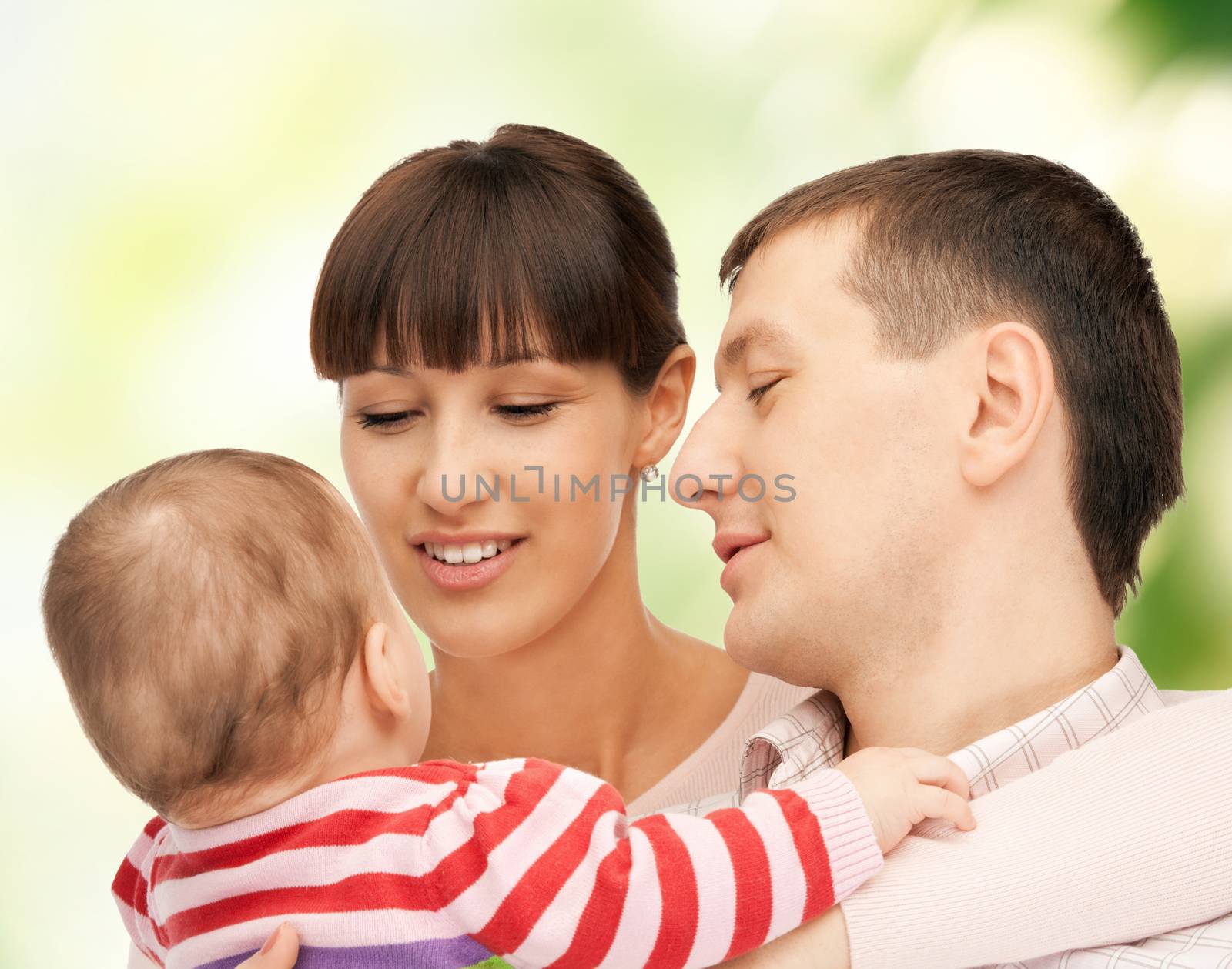 picture of happy mother and father with adorable baby (focus on man)