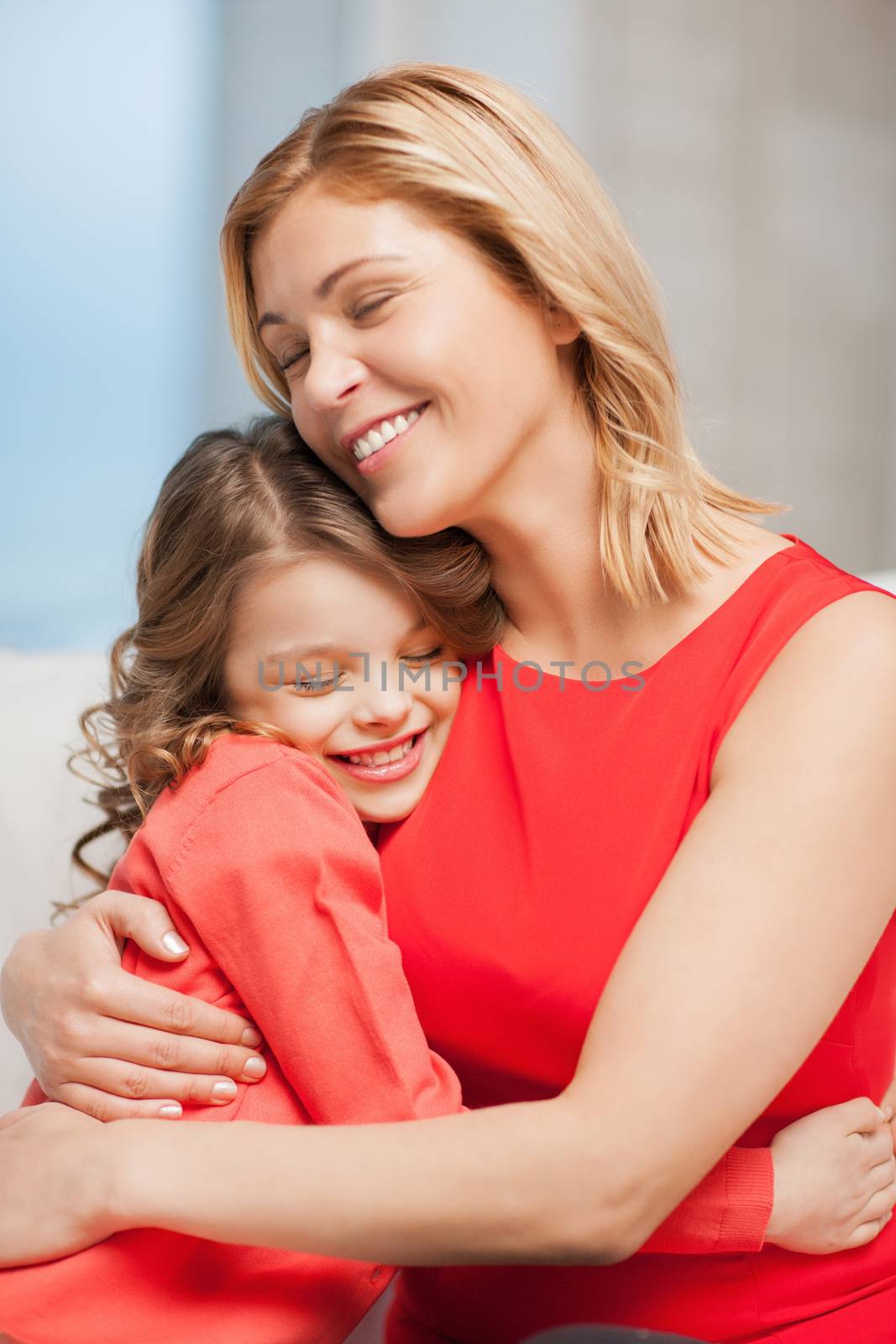 bright picture of hugging mother and daughter