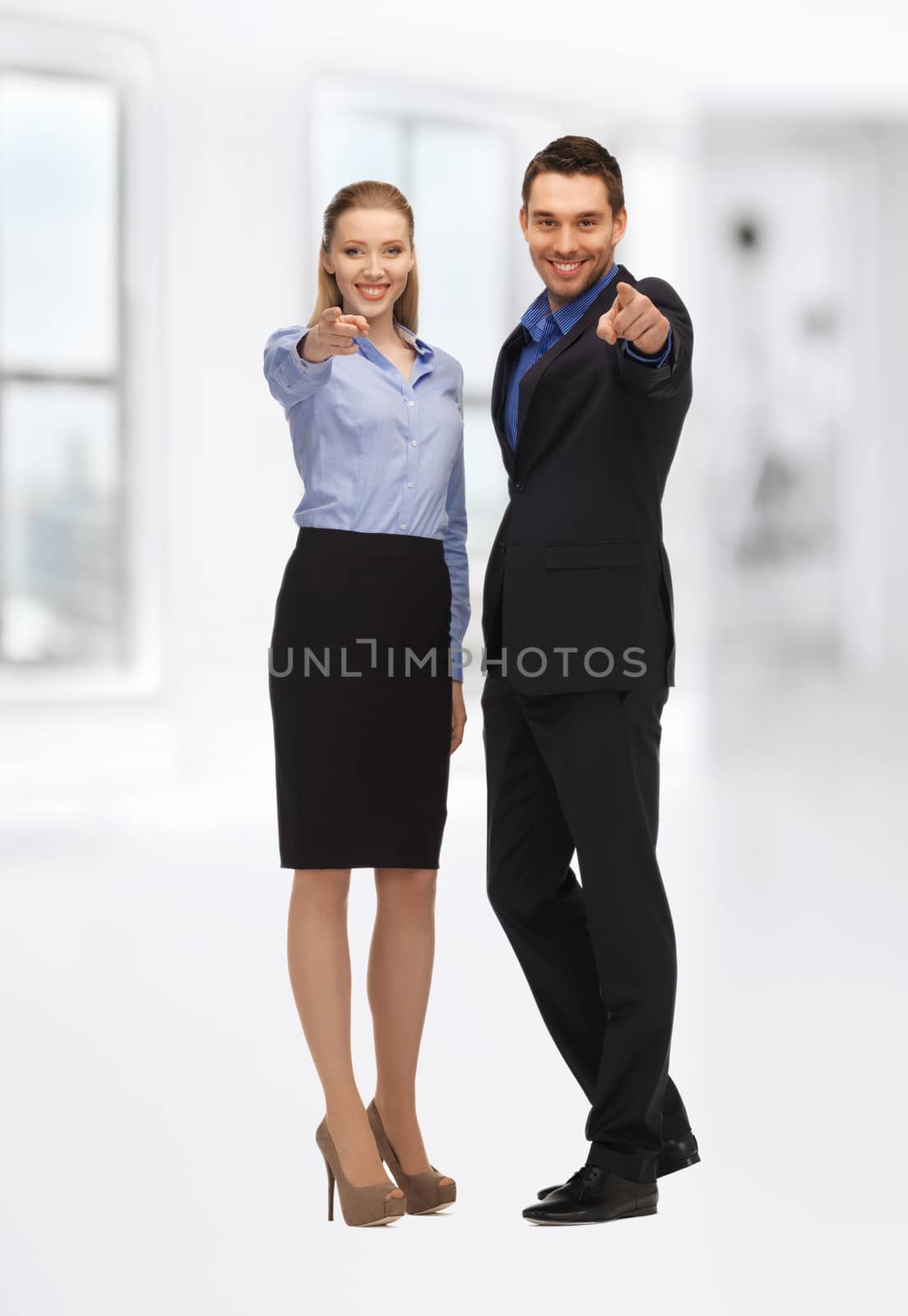 bright picture of man and woman pointing their fingers