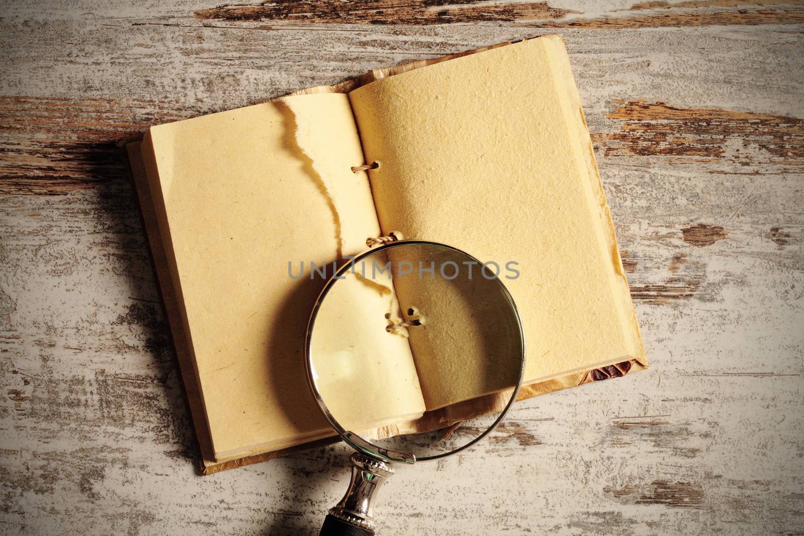 notebook and magnifying glass by erllre