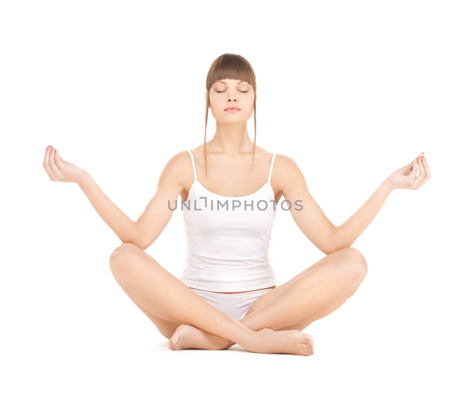 woman practicing yoga by dolgachov