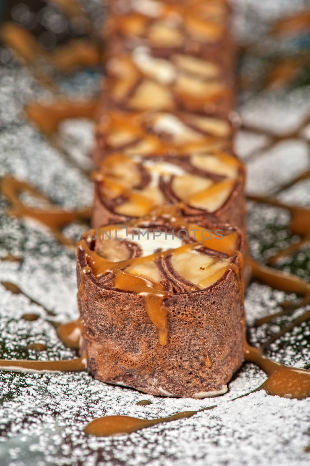 Chocolate roll with various caramel and cream