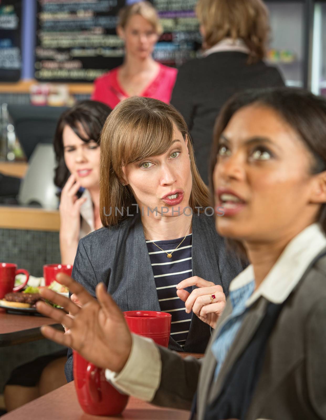 Woman bothering coworker in cafeteria at work