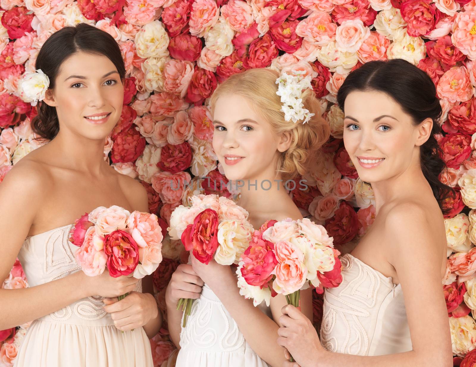 beautiful three women with background full of roses