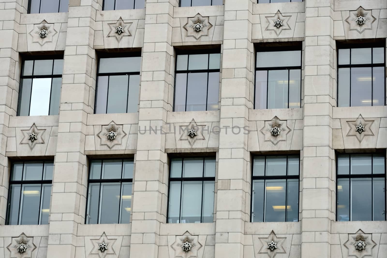 Rectangular windows on modern office building by pauws99