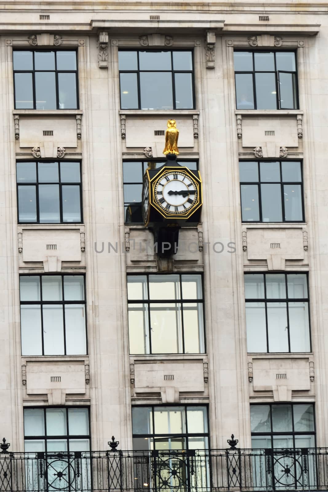 Urban antique clock on building