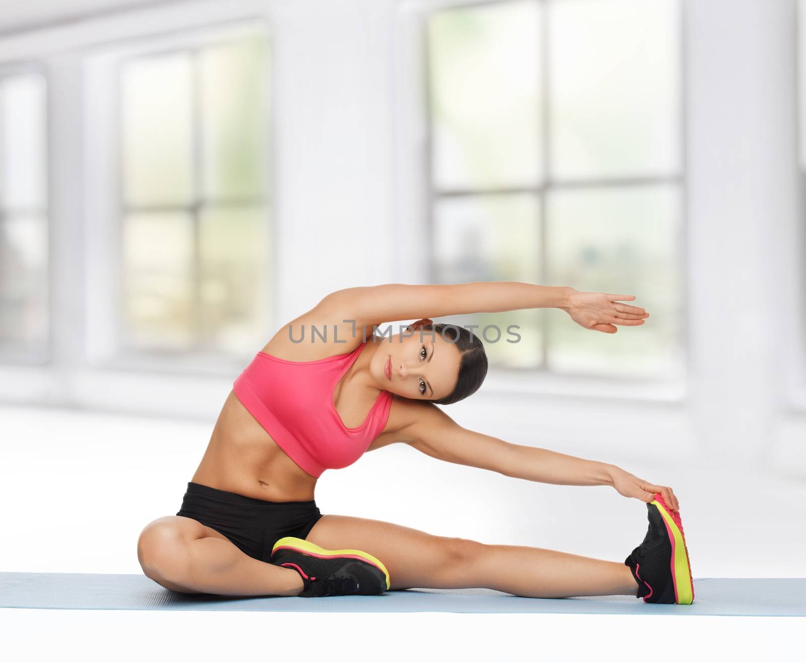 beautiful sporty woman doing exercise on the floor