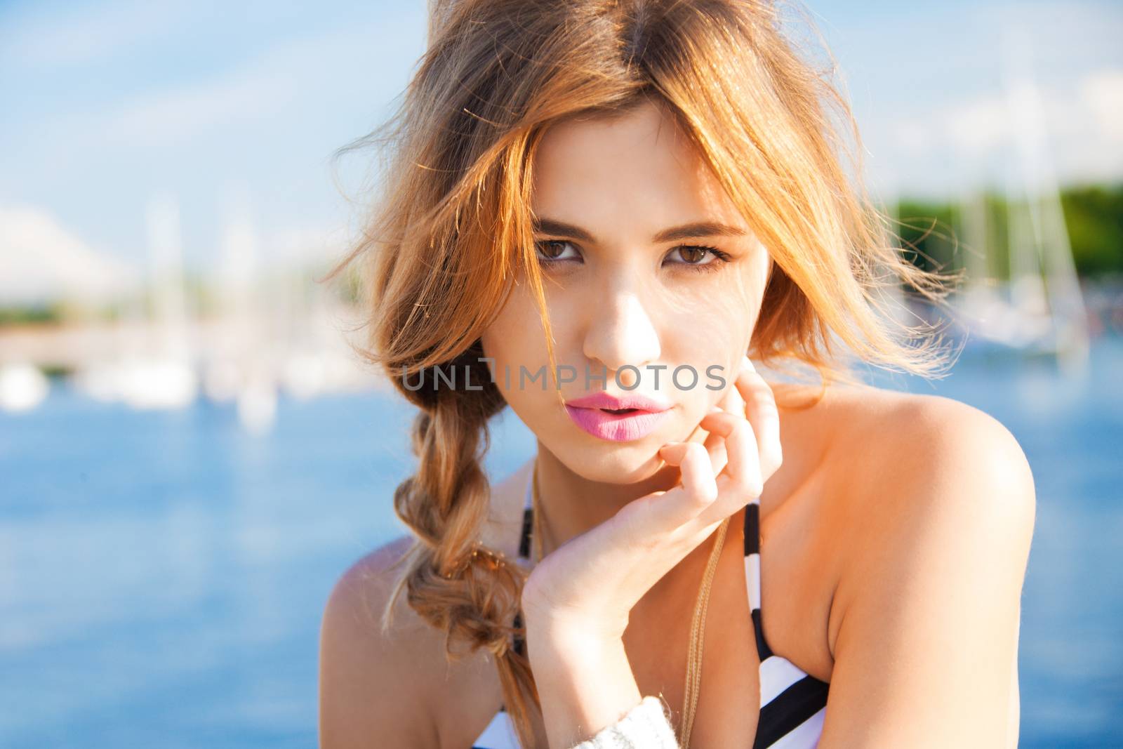 portrait of fashion model posing on the beach