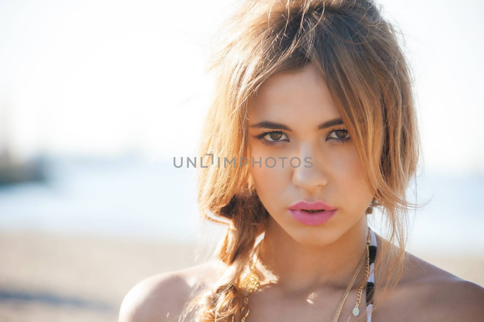 fashion model posing on the beach by dolgachov