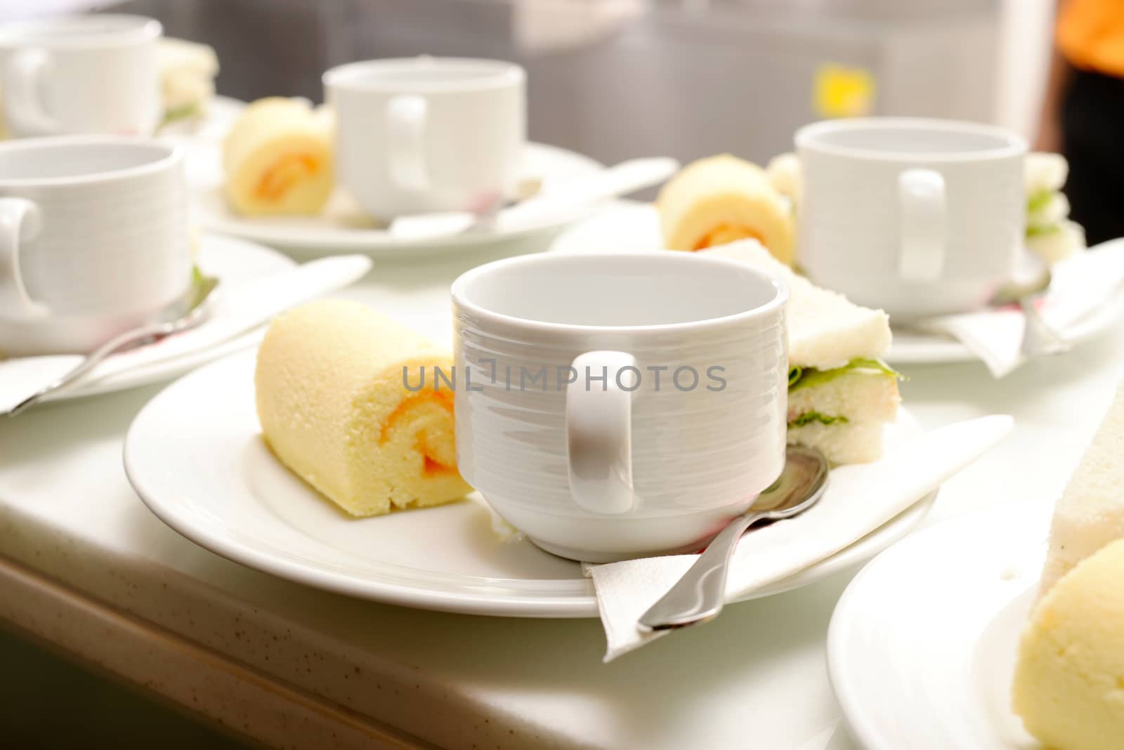 Hot coffee in white cup with sanwich ham&cheese and sweetmeat