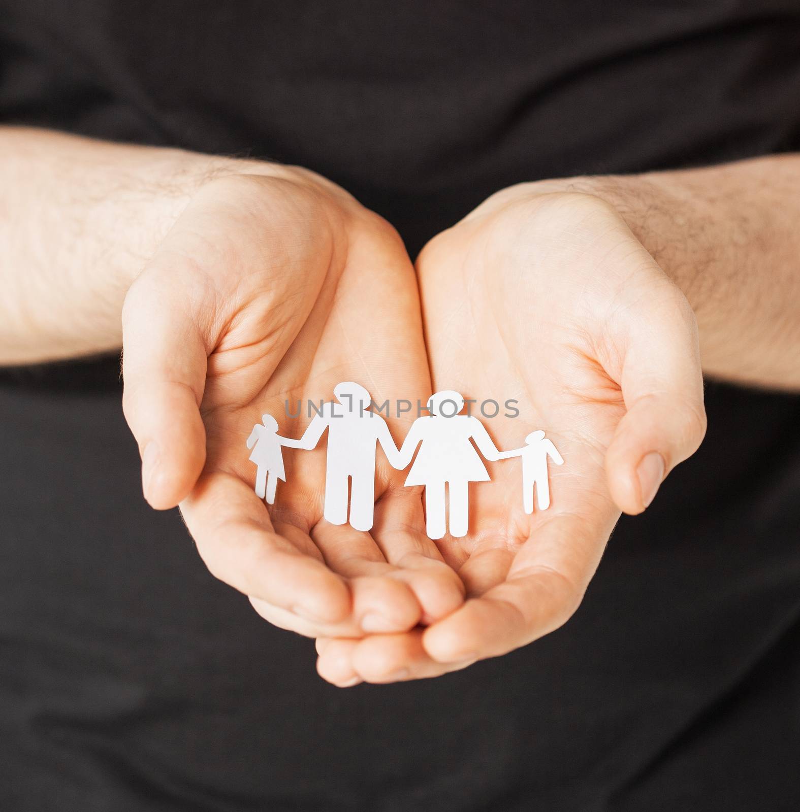 man hands showing family of paper men