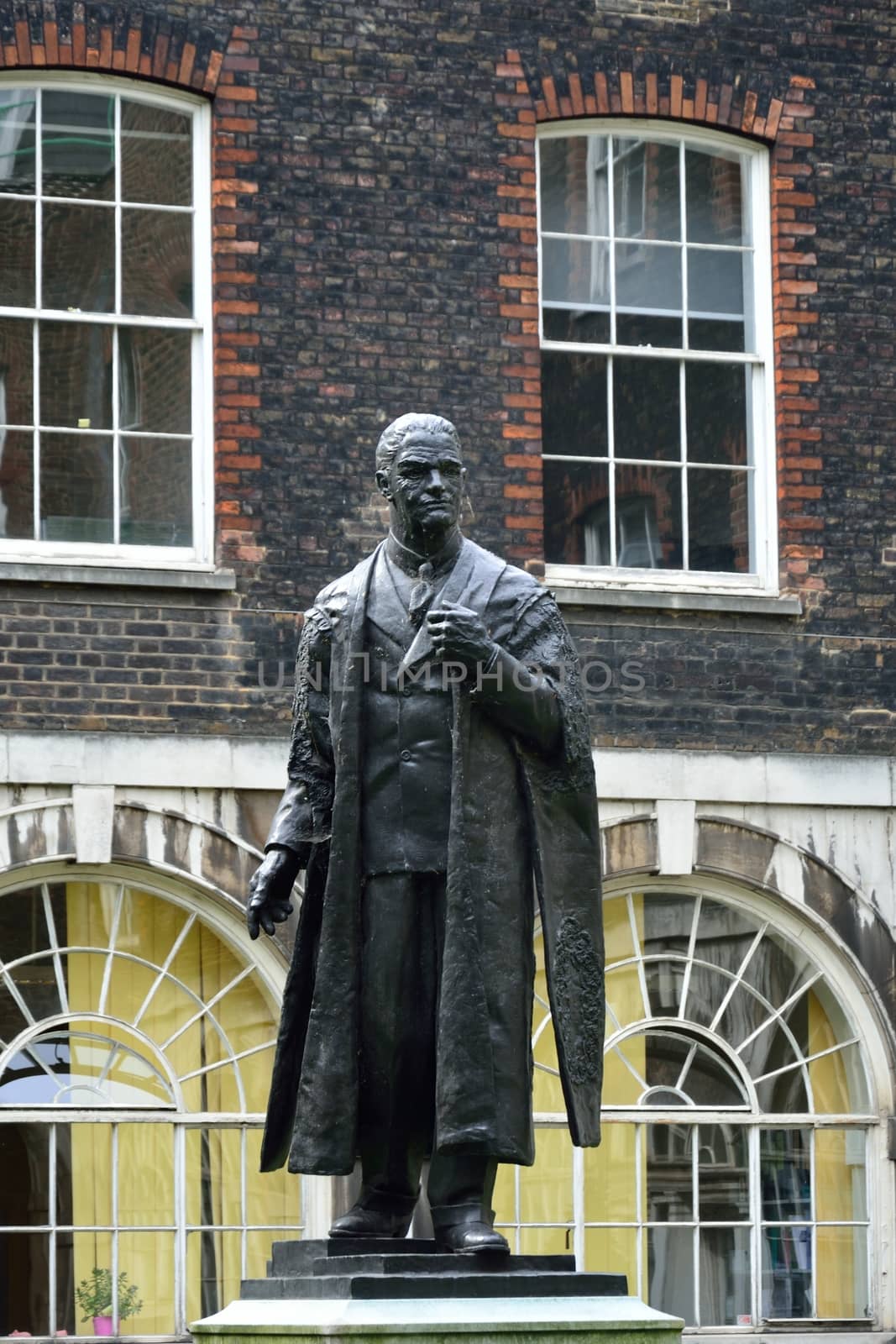 statue of lord nuffield standing in square