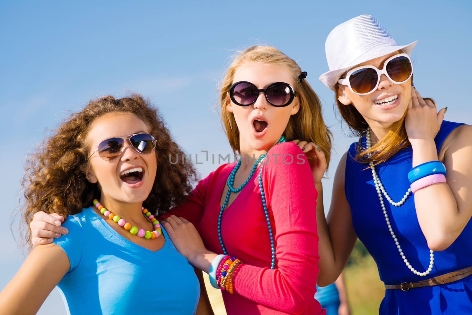 three young attractive girls having fun together, spend fun time with friends