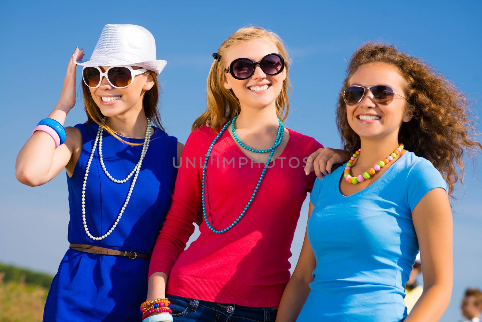 three young attractive girls having fun together, spend fun time with friends